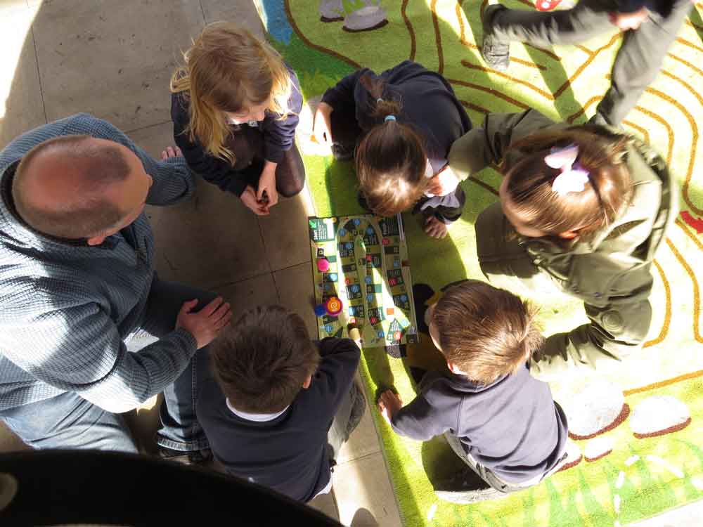 Children playing an environmental game at Nields School